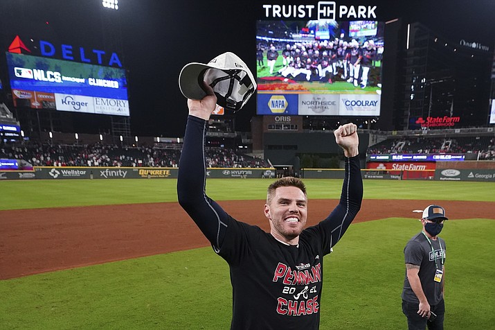 Atlanta Braves Freddie Freeman celebrates after Game 4 of a National League Division Series against the Milwaukee Brewers, Tuesday, Oct. 12, 2021, in Atlanta. The Atlanta Braves won 5-4 to advance to the NLCS. (John Bazemore/AP)