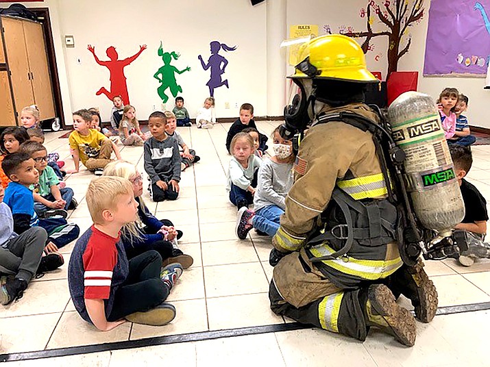 Firefighters with Williams Fire talks to students about smoke and CO alarms, creating escape plans and stop, drop and roll Oct. 13. (Photo/Williams Elementary-Middle School)