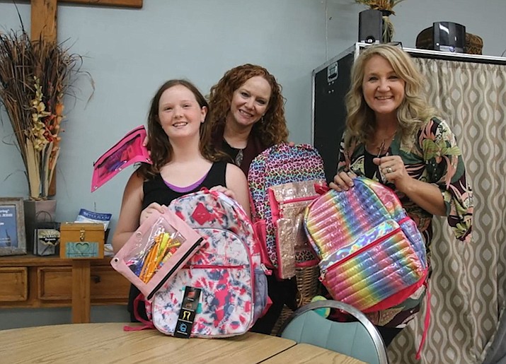 United Way Executive Director Patty Bell-Demers, right, Old Town Mission in the Verde Valley Executive Director Kellie Wilson, rear, and her daughter after filling back-to-school backpacks at the Old Town Mission. (Patty Bell-Demers/Courtesy)