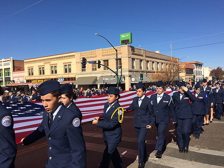 Members of the local Air Force ROTC carry a large U.S. Flag during the 2019 Veterans Day Parade in downtown Prescott. Prescott is inviting entrants for this year’s parade on Nov. 11. (Nanci Hutson/Courier, file)