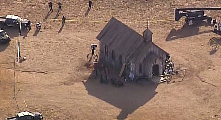 This aerial video image provided by KOAT 7 News, shows Santa Fe County Sheriff's Officers responding to the scene of a fatal accidental shooting at a Bonanza Creek, Ranch movie set near Santa Fe, N.M. Thursday, Oct. 21, 2021. Authorities say a woman has been killed and a man injured Thursday after they were shot by a prop firearm at a movie set outside Santa Fe. The Santa Fe County Sheriff's Office says a 42-year-old woman was airlifted to a hospital, where she died, while a 42-year-old man was getting emergency care at another hospital. (KOAT 7 News via AP)