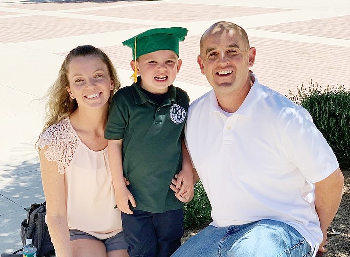 Verde Valley Fire District Firefighter Tyrone Bell, far right, died in the line of duty Oct. 18, 2021, after complications from COVID-19. He leaves behind his wife, Ashli, left, and 5-year-old son, Tyson. (VVFD/Courtesy)