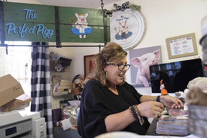 Ginger Pigg in her gift boutique The Perfect Pigg in Cumming, Ga. on Thursday afternoon, Oct. 22, 2021. She says she is struggling to get products to her store in a timely way. (Ben Gray/AP)