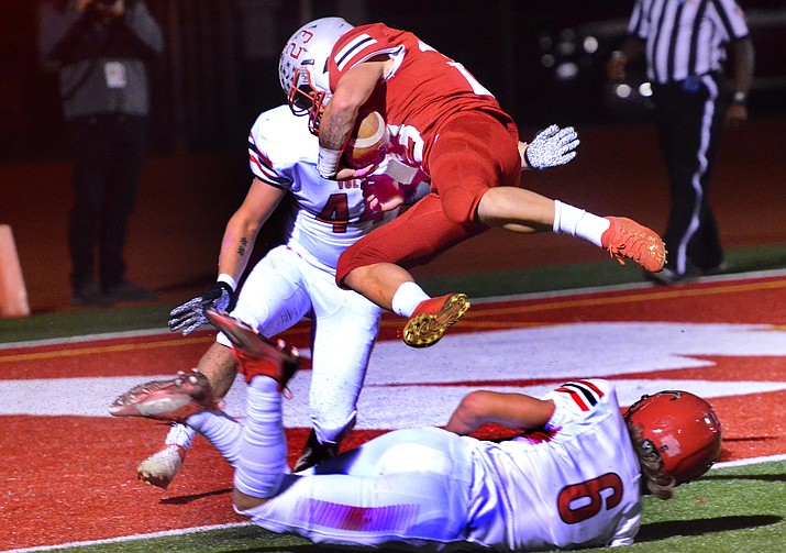 Mingus running back Angelo Alvarez (23) dives into the end zone for a game-opening touchdown Friday, Oct. 29, 2021, in Cottonwood. Alvarez had two scores on the night, but the Marauders loss to Lee Williams 49-31. (Vyto Starinskas/Independent)