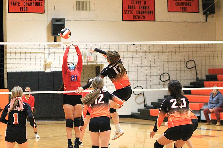 Shaelee Echeverria spikes the ball over a defender in an earlier season game. (Wendy Howell/WGCN)
