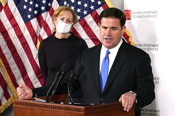 Arizona Gov. Doug Ducey speaks at a press conference in Phoenix in 2020. In the summer of 2021 Ducey signed into law several measures that restricted the power of local governments to enact COVID-19 protection measures. On Monday, Sept. 27 a judge struck down Arizona laws prohibiting public school districts from imposing mask requirements, colleges from requiring vaccinations for students and communities from establishing vaccine passports for people to show they were vaccinated. (AP Photo/Ross D. Franklin, Pool, File)