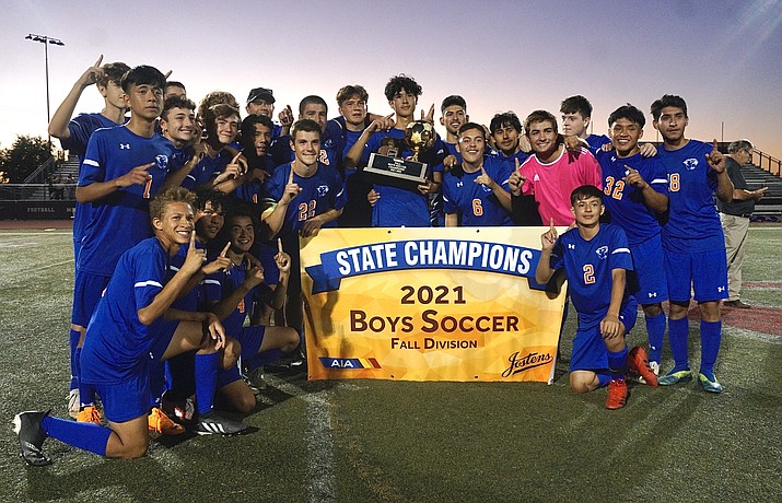 Chino Valley boys soccer takes a team photo with their trophy and banner after winning the 2A Conference Fall Division State Championship by defeating Camp Verde 2-1 on Saturday, Nov. 6, 2021, at Williams Field High School in Gilbert. (Aaron Valdez/Courier)