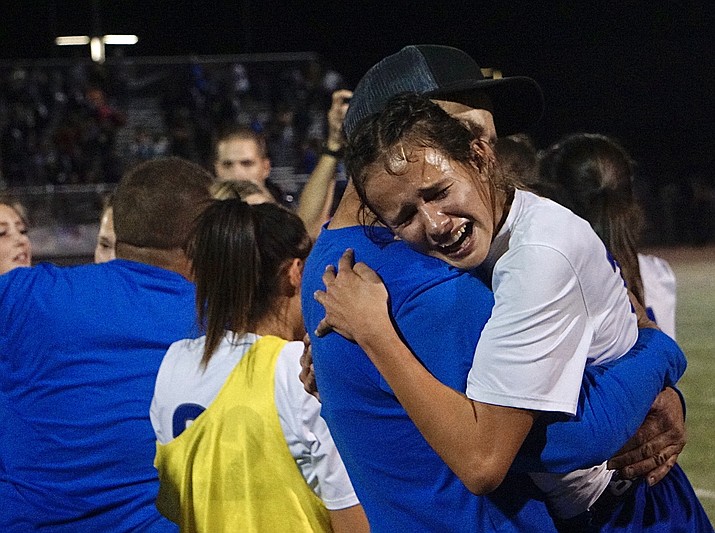 Chino Valley forward Danielle Graham celebrates with a coach after the team defeated Northland Prep 1-0 in the 2A Conference Fall Division State Championship game on Saturday, Nov. 6, 2021, at Williams Field High School in Gilbert. Graham scored the game-winning goal to help the Cougars capture the state title. (Aaron Valdez/Courier)