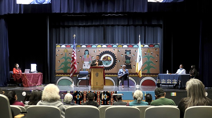Hopi Chairman Tim Nuvangyaoma speaks to an audience gathered for a debate between candidates at the tribe's high school in Polacca, Arizona, on Saturday, Nov. 6, 2021. Nuvangyaoma faces David Talayumptewa, seated on stage, in the election Thursday, Nov. 11, 2021. (AP Photo/Felicia Fonseca)