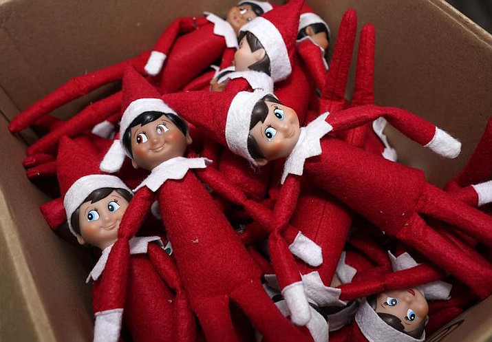 Elf on the Shelf figures are piled in a box at the company's studio Thursday, Aug. 27, 2020, in Atlanta. Santa may have fewer eyes in homes in the 2021 Christmas season after a judge — jokingly — banned the Elf on the Shelf. (John Bazemore/AP file)
