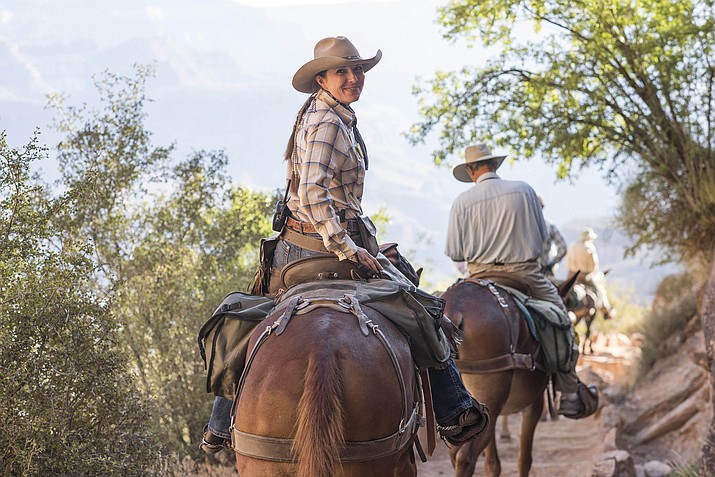 Lisa “Tex” Parker helps guide a mule train on the South Kaibab Trail in Grand Canyon National Park. From New York City, this is Parker’s third season working as a wrangler for Xanterra Travel Collections South Rim Mule Operations. (V. Ronnie Tierney/WGCN)