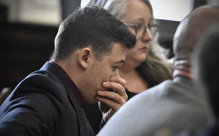 Kyle Rittenhouse puts his hand over his face after he is found not guilty on all counts at the Kenosha County Courthouse in Kenosha, Wis., on Friday, Nov. 19, 2021. The jury came back with its verdict afer close to 3 1/2 days of deliberation. (Sean Krajacic/The Kenosha News via AP, Pool)