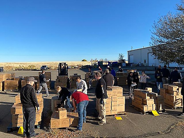 Volunteers help unload 1,478 cases of donated food from Salt Lake City. (Prescott Valley Stake of the Church of Jesus Christ of Latter-Day Saints/Courtesy)