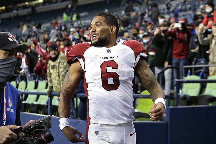 Arizona Cardinals’ James Conner smiles as he heads off the field after his team defeated the Seattle Seahawks in a game, Sunday, Nov. 21, 2021, in Seattle. (John Froschauer/AP)