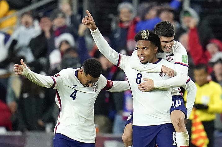 United States’ Weston McKennie celebrates his goal with Tyler Adams, left, and Christian Pulisic during the second half of a FIFA World Cup qualifying match against Mexico, Friday, Nov. 12, 2021, in Cincinnati. The U.S. won 2-0. (Julio Cortez/AP)