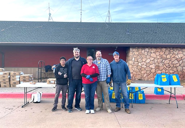 Volunteers along with Tusayan Vice Mayor Brady Harris, help distribute turkeys Nov. 19 at Grand Canyon National Park Airport in Tusayan. (Photo courtesy of the town of Tusayan)