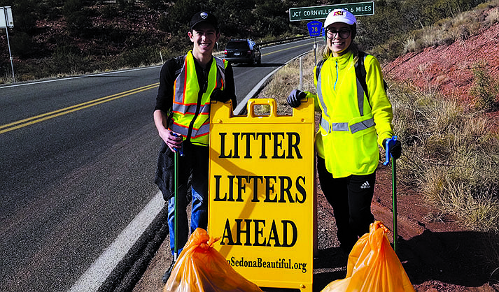 In this undated file photo, two litter lifters from Keep Sedona Beautiful pose for a photo. This Dec. 11, 2021, it will be 50 years since KSB starting picking up litter in Sedona. (KSB/Courtesy)