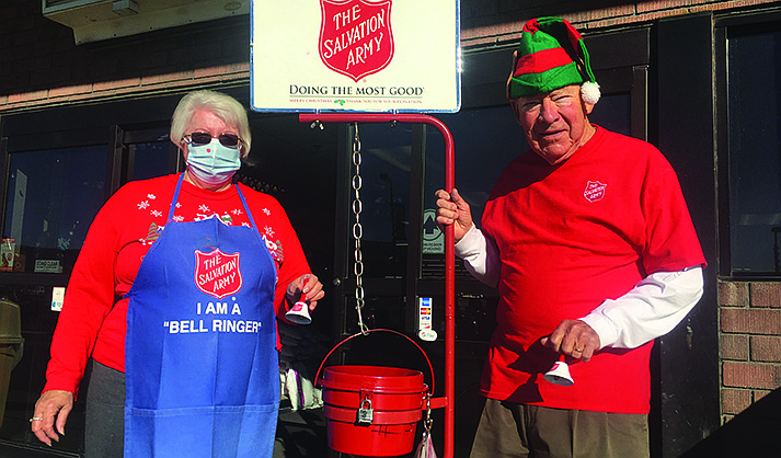 Salvation Army bell ringers Patty Kaminsky and Tom Bast returned to Bashas’ in Camp Verde on Tuesday, Nov. 30, 2021, for the first time in two years after COVID canceled their ringing last year. They have rung bells there for more than 25 years. (Verde Independent/Vyto Starinskas)