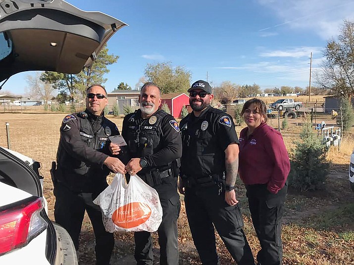 In an effort put together by the Chino Valley Education Foundation and the Chino Valley Police Officers Association, Chino Valley Police Department officers went around town on Wednesday, Nov. 24, 2021, to deliver meals to families in need for the Thanksgiving holiday. (CVPD/Courtesy)