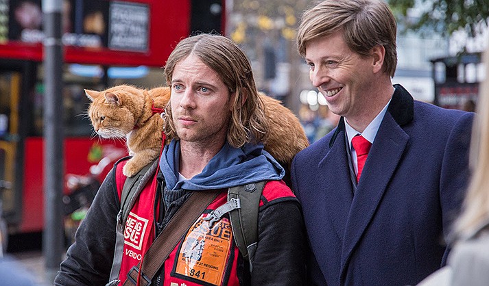 Christmas gifts come in all shapes and sizes. For James (Luke Treadaway), a struggling street musician, a very special one arrives in the form of Bob, a strong-willed stray cat who wanders into James’s tiny flat in the heartwarming new holiday film “A Gift from Bob.” (SIFF/Courtesy)