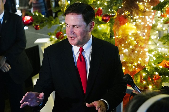 Arizona Republican Gov. Doug Ducey speaks as he hosts the annual Arizona State Capitol Christmas tree lighting ceremony Wednesday, Dec. 1, 2021, in Phoenix. (Ross D. Franklin/AP)