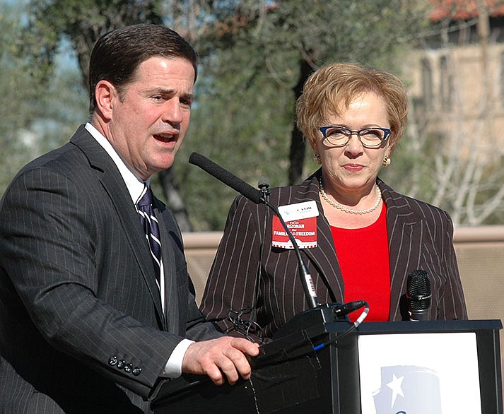 Gov. Doug Ducey in 2015, shortly after being elected, speaking to members of the anti-abortion Center for Arizona Policy at the Capitol. With him is CAP President Cathi Herrod. (Capitol Media Services file photo by Howard Fischer)