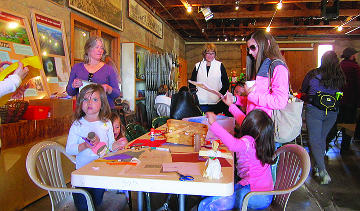 Visitors make old-time ornaments in the fruit-packing shed at Sedona Heritage Museum. (Courtesy)