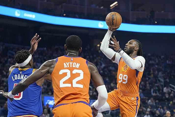 Phoenix Suns forward Jae Crowder (99) shoots against the Golden State Warriors during the first half of an NBA basketball game in San Francisco, Friday, Dec. 3, 2021. (AP Photo/Jeff Chiu)