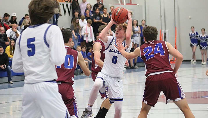 Kaden Hatchell of Kingman Academy pulls up for a shot during the Tigers’ loss to Northland Prep on Thursday, Dec. 2. (Photo by Travis Rains/Kingman Miner)