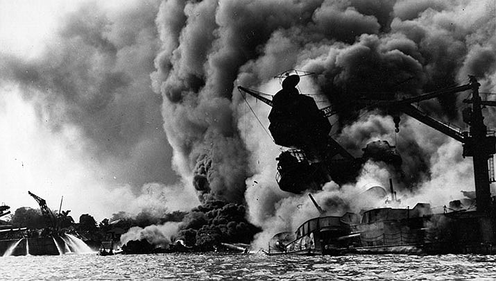 The battleship USS Arizona is shown ablaze during the Japanese attack on Pearl Harbor on Dec. 7, 1941. (Public domain)