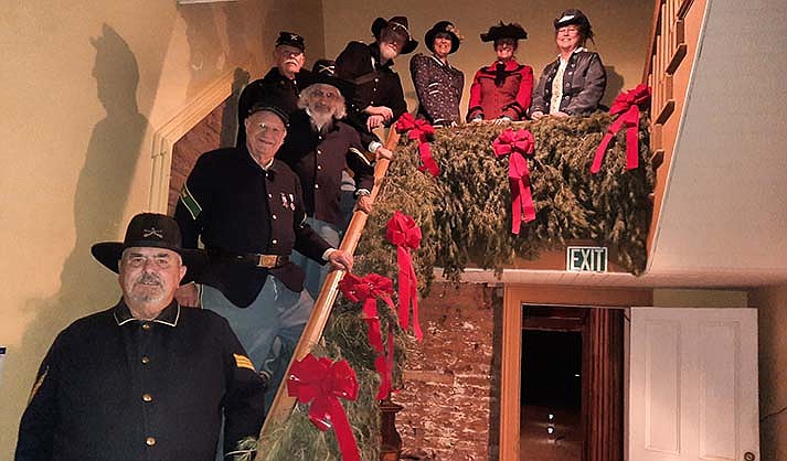 Re-enactors pose on the stairs of one of the Victorian decorated historic buildings at Fort Verde State Historic Park. (Fort Verde/Courtesy)