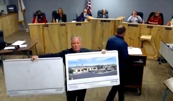 Town Manager Russ Martin holds up drawings during the Camp Verde Council meeting on Wednesday, Dec. 15, 2021.
