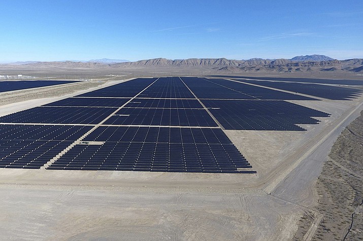 In this Dec. 11, 2017, file photo, solar arrays line the desert floor of the Dry Lake Solar Energy Zone as part of the 179 megawatt Switch Station 1 and Switch Station 2 Solar Projects north of Las Vegas. The Biden administration on Tuesday, Dec. 21, 2021, issued a solicitation for interest in developing solar power on public lands in Nevada, New Mexico and Colorado. (Michael Quine/Las Vegas Review-Journal via AP, File)