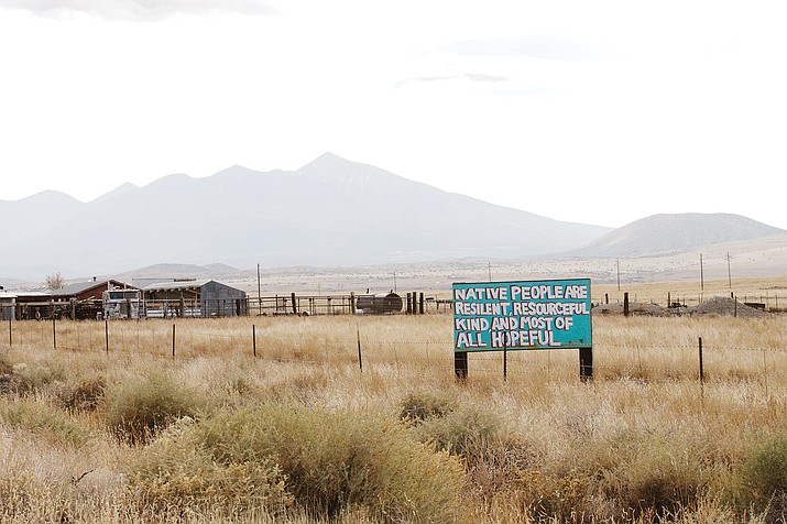 A newer addition to the timeless landscape of the Navajo Nation is a series of turquoise signs along southbound U.S. 89 near Tuba City. (Photo by Sierra Alvarez/Cronkite News)