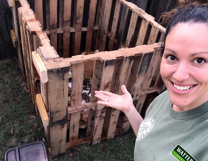 Rachel, at Watters Garden Center, shows off a simple compost bin, made from pallets. (Courtesy)