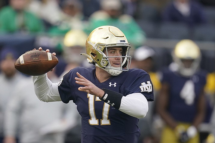 Notre Dame quarterback Jack Coan (17) throws during the first half of an NCAA college football game against Georgia Tech, Saturday, Nov. 20, 2021, in South Bend, Ind. Coan finally got a chance to don the Irish blue and gold in his final college season. He gets a chance to cap his season in a major way at the New Year's Day Fiesta Bowl. (AP Photo/Darron Cummings, AP File)
