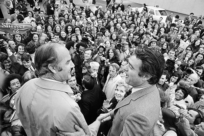 South Dakota Sen. George S. McGovern, left, is met by R. Sargent Shriver, his running mate on the losing Democratic ticket, and a crowd of well-wishers at Washington's National Airport in Arlington, Virginia on Nov. 8, 1972. McGovern and his wife, Eleanor, applauding at left of Shriver, returned to Washington from South Dakota where they spent Election Day. In 2022, Native American tribes are marking 50 years since the U.S. government's termination policy, considered an economic and human rights disaster, came to an end, making way for self-determination. More than 100 tribes were terminated under the policy, resulting in the loss of more than 1.3 million acres. (AP Photo/File)