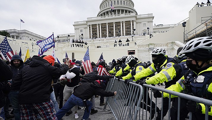 Lawmakers are recalling the trauma they experienced as rioters penetrated the U.S. Capitol building on Jan. 6, 2021, nearly one year ago. (AP file photo)