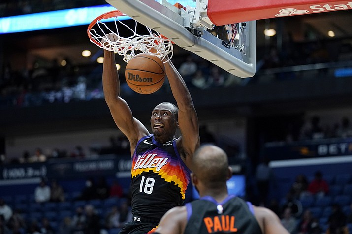Phoenix Suns center Bimack Biyombo (18) clam dunks in the second half of a game against the New Orleans Pelicans in New Orleans, Tuesday, Jan. 4, 2022. The Suns won 123-110. (Gerald Herbert/AP)