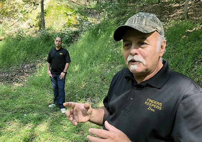 This Sept. 20, 2018 photo shows Dennis Parada, right, and his son Kem Parada at the site of the FBI's dig for Civil War-era gold in Dents Run, Pa. Government emails released under court order show that FBI agents were looking for gold when they excavated Dent's Run in 2018, though the FBI says that nothing was found. The treasure hunters have filed suit against the Justice Department over its failure to produce documents related to the FBI's 2018 search for Civil War-era gold at the remote woodland site. (Michael Rubinkam/AP, File)