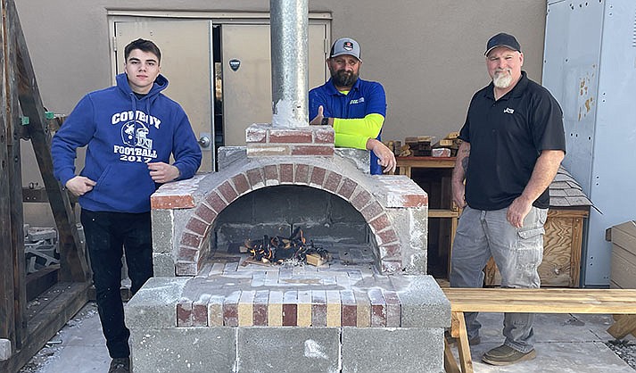 VACTE teacher Travis Black and his students worked with the Arizona Masonry Council's Ryan Gray to build a functioning pizza oven. (Courtesy)