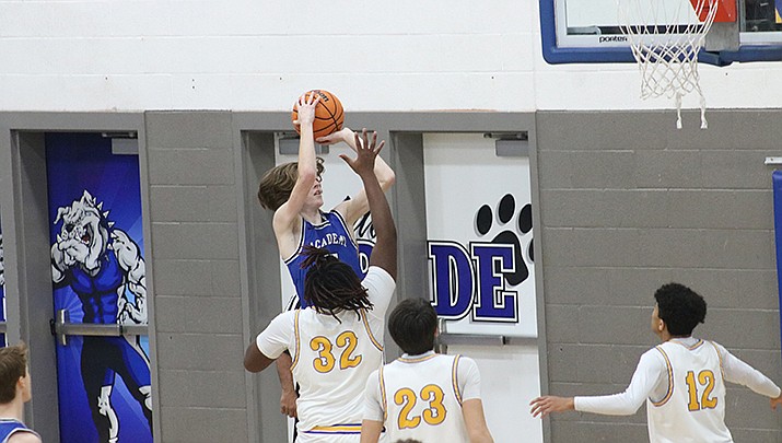 Kingman Academy’s Wesley High takes a shot during the Tigers’ 62-58 win over Kingman on Thursday, Jan. 6. (Photo by Travis Rains/For the Miner)