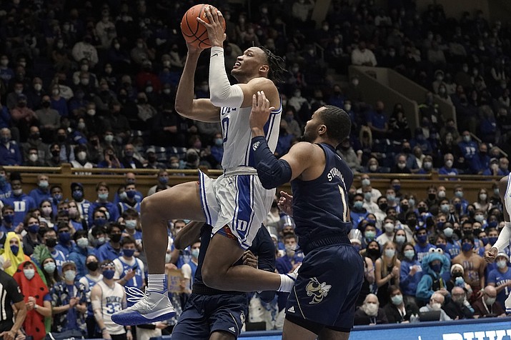 Duke forward Wendell Moore Jr. (0) drives to the basket against Georgia Tech guard Kyle Sturdivant (1) during the second half of a game in Durham, N.C., Tuesday, Jan. 4, 2022. (Gerry Broome/AP)