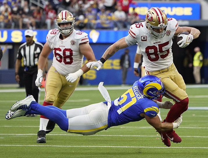 Los Angeles Rams inside linebacker Troy Reeder (51) tackles San Francisco 49ers tight end George Kittle (85) during the second half of an NFL football game Sunday, Jan. 9, 2022, in Inglewood, Calif. (AP Photo/Marcio Jose Sanchez)