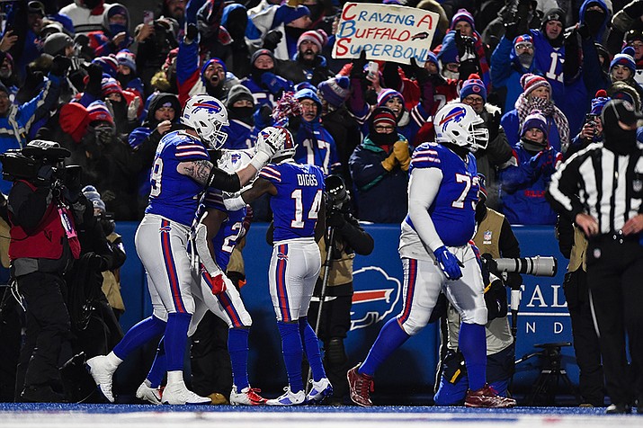 Buffalo Bills running back Devin Singletary, second from left, celebrates his touchdown with his teammates during the first half of an NFL wild-card playoff football game against the New England Patriots, Saturday, Jan. 15, 2022, in Orchard Park, N.Y. (Adrian Kraus/AP)