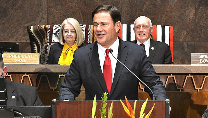 Arizona Gov. Doug Ducey’s $14B budget plan includes a tax credit for Arizona’s working poor. Ducey is shown delivering his State of the State speech to the Legislature on Monday, Jan. 10. (File photo by Howard Fischer/For the Miner)