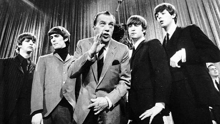 Ed Sullivan, on Feb. 9, 1964, rehearses his television variety show with the Beatles. (Associated Press, file)