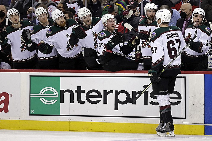 Arizona Coyotes left wing Lawson Crouse (67) celebrates with teammates after scoring a goal against the New Jersey Devils during the second period of an NHL hockey game Wednesday, Jan. 19, 2022, in Newark, N.J. (Adam Hunger/AP)