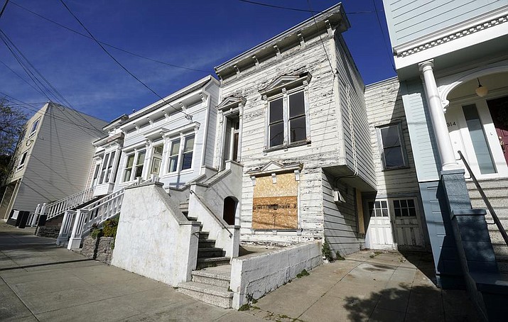 A recently sold Victorian home is shown in San Francisco, Friday, Jan. 14, 2022. The decaying, 122-year-old Victorian marketed as "the worst house on the best block" of San Francisco recently sold for nearly $2 million — an eye-catching price. (Jeff Chiu/AP)