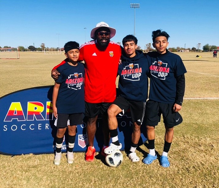Arizona ODP coach Phil Reid, second from left, stands with local players Alan Flores, left, Jair Montoya. second from right, and Carlos Flores after they competed in US Youth Soccer’s ODP West Regional Tournament in Phoenix from Jan. 7 to 10, 2022. (Phil Reid/Courtesy)